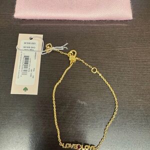 Kate Spade 7, 8 or 9” Gold Color Love Bracelet with Red Gem- New